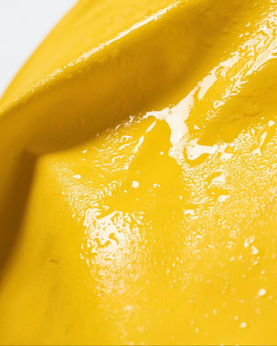 Close-up of the yellow raincoat fabric